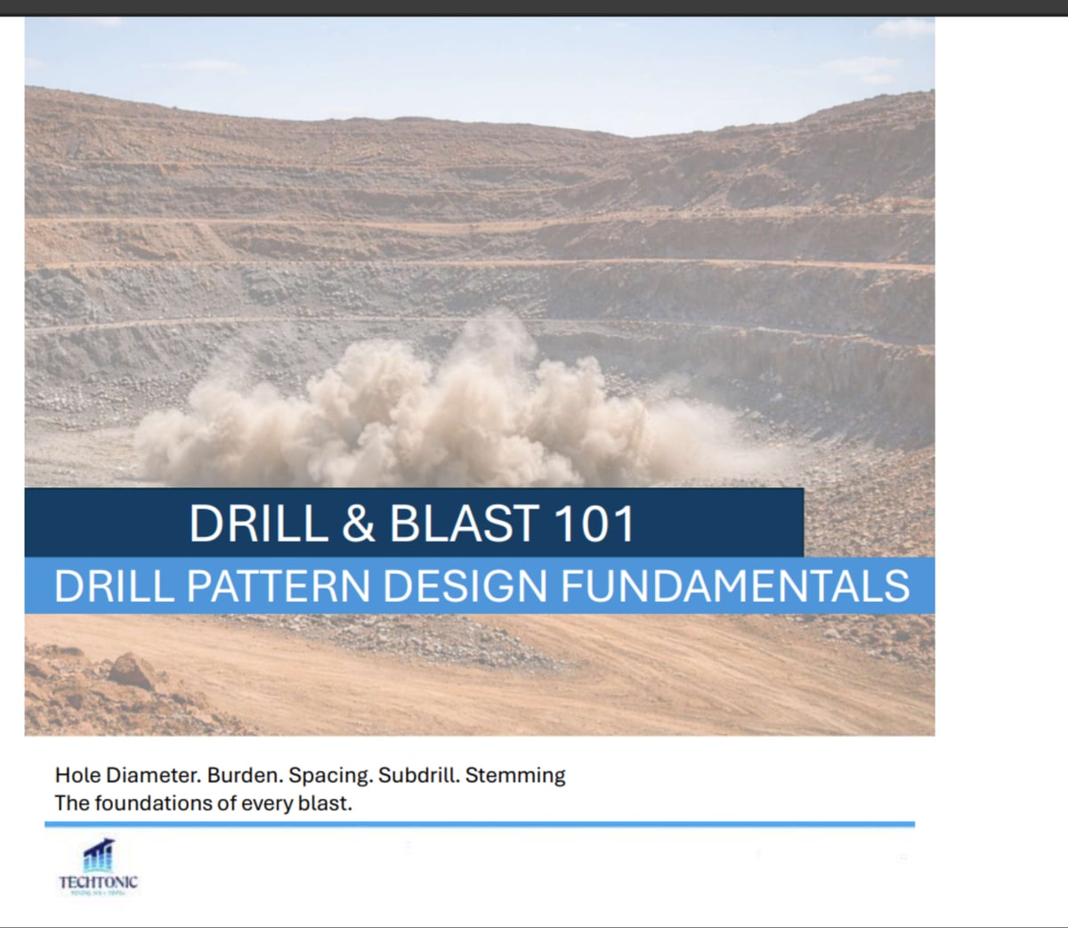 A blast firing on an open pit bench, throwing dust across the pit