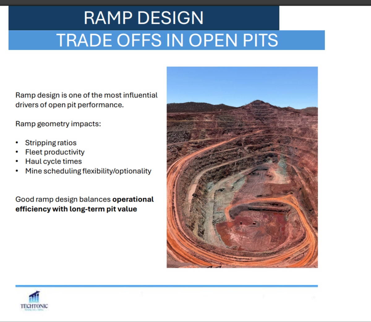Aerial view of an open pit showing the ramp system spiralling down the pit wall